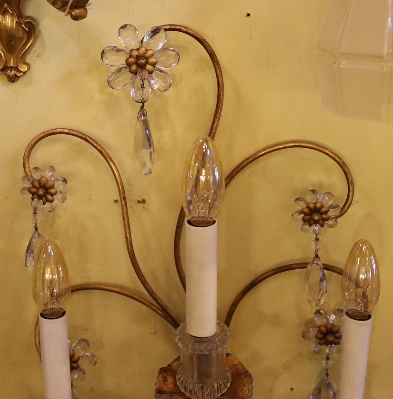 An early 20th century French gilt metal and Baccarat crystal triple branch wall light, height 68cm. width 36cm